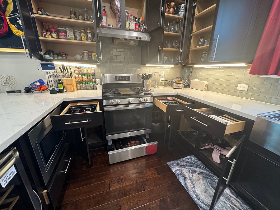 Fully stocked kitchen with spices, kitchenware, drinkware, bakingware, pots & pans, etc., whatever one might need to prepare a fast or slow meal at home
