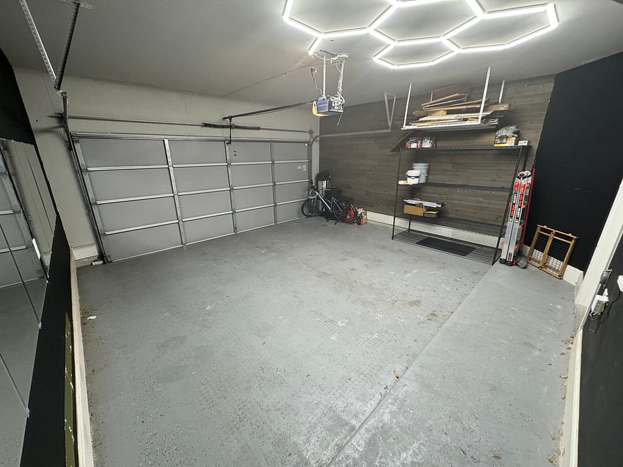 Two car garage with water softener and storage shelves