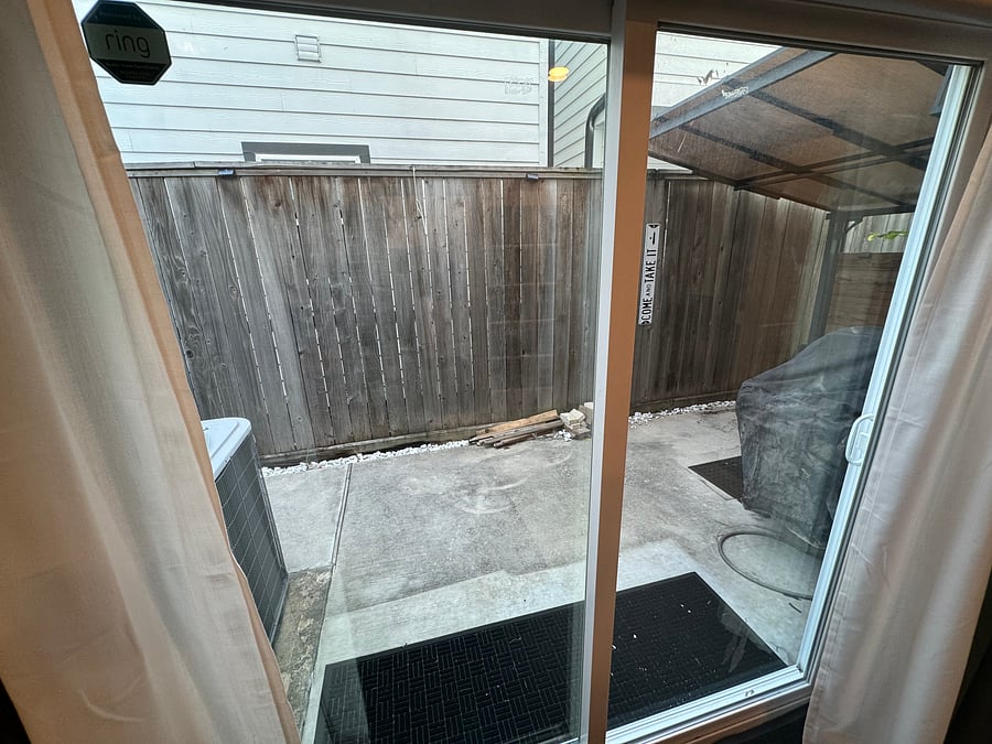 Ground floor bedroom sliding door access to back patio