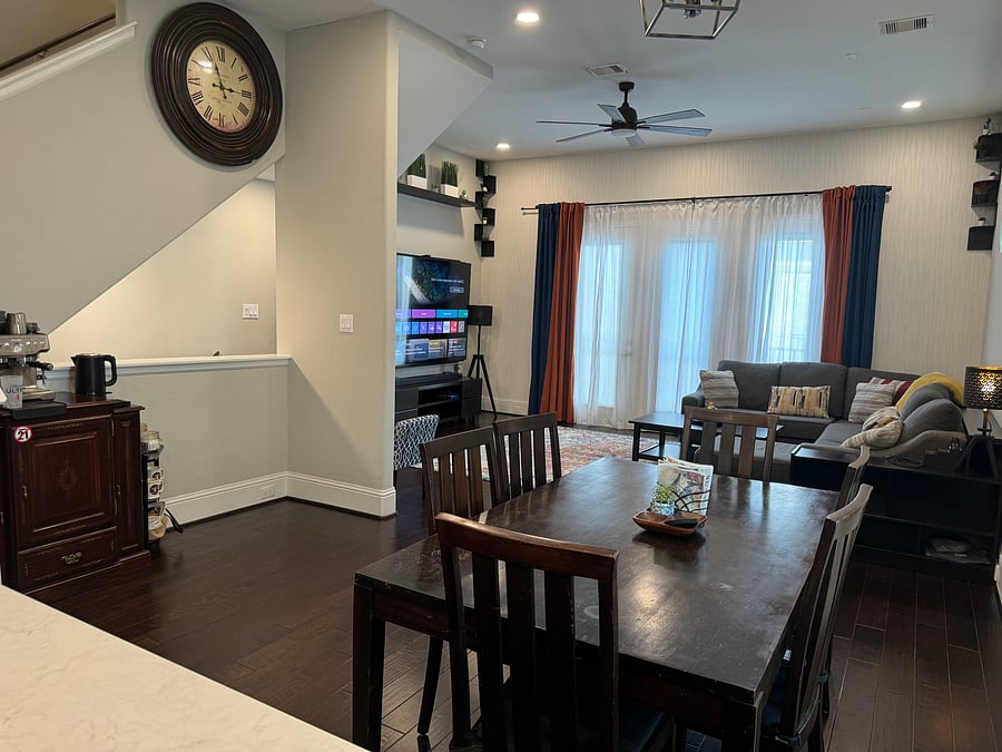 Open floor plan dining room 6-seater table and coffee/tea nook adjacent to living room
