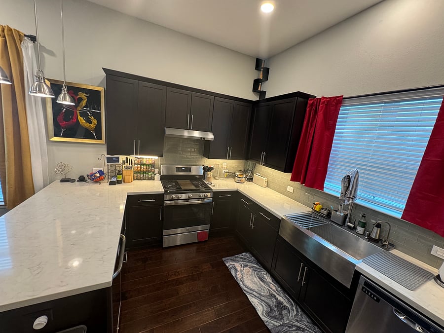 Spacious kitchen equipped with gas stove, rice cooker, blender, standing mixer (not pictured), deep single basin kitchen sink, wine/beer fridge