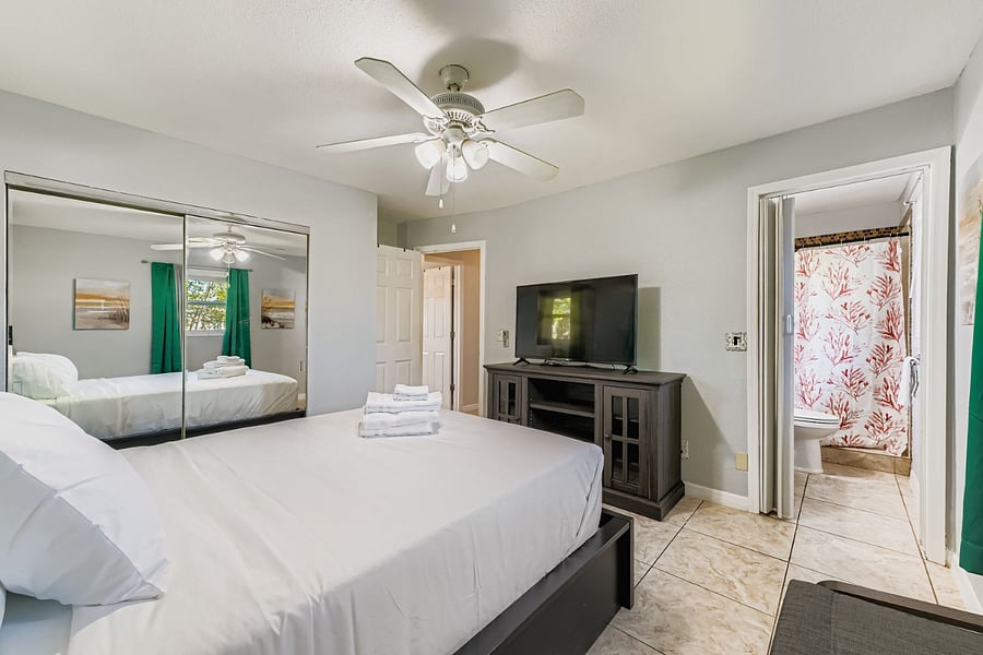 Master bedroom with smart TV and Queen bed.