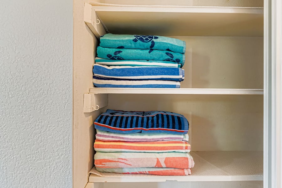 hallway closet with beach/pool towels. 