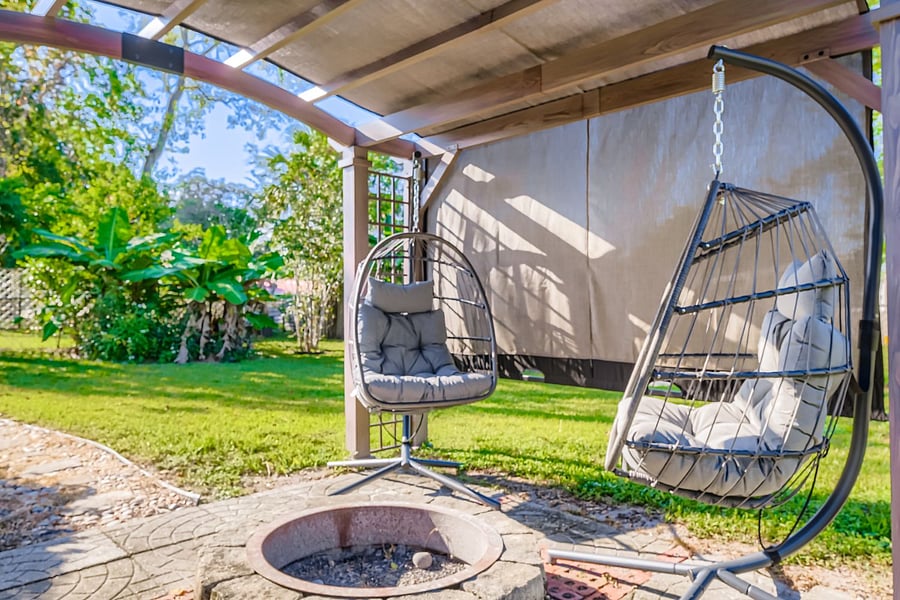 Pergola hanging egg chairs.