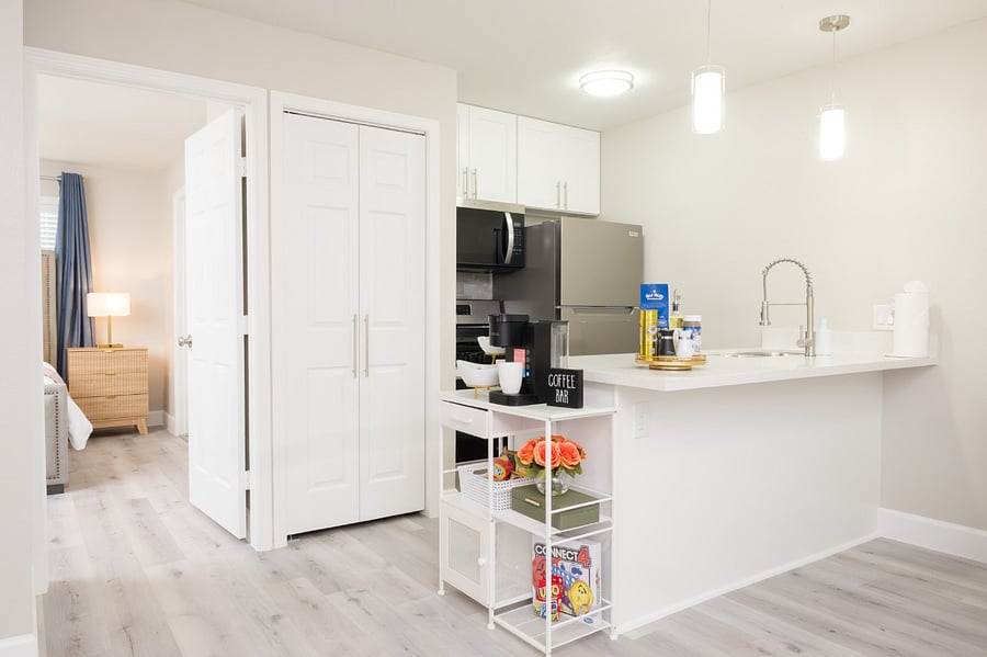 Bright, open-concept living with a cozy coffee station and breakfast bar for your morning routine.