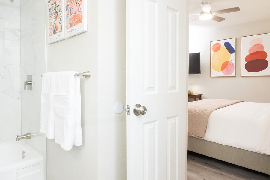 The room has easy access to the minimalist bathroom.