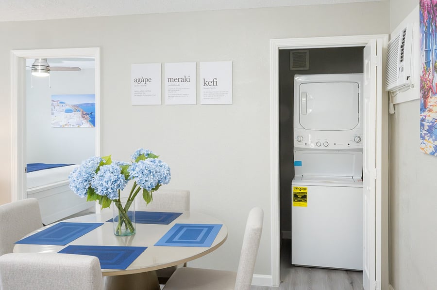 Enjoy the convenience of an in-unit washer and dryer tucked away near this inviting dining nook.