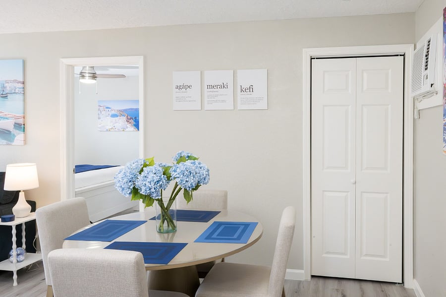 Bright dining nook, featuring minimalist wall art and a clean aesthetic.