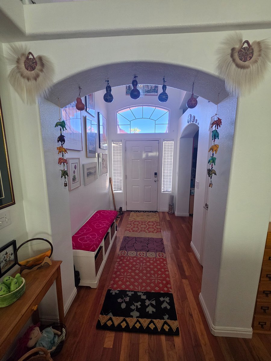 Front door inside entry - gourds and elephants bring good luck, protect the household from negative energy, and invite prosperity to all who enter.
