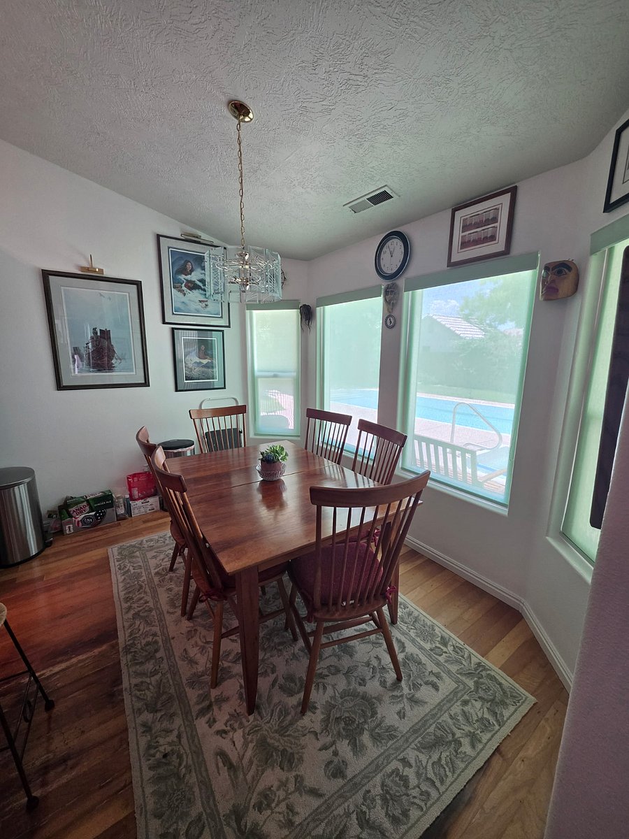 Dining room seats 6 in Bay window with backyard view.