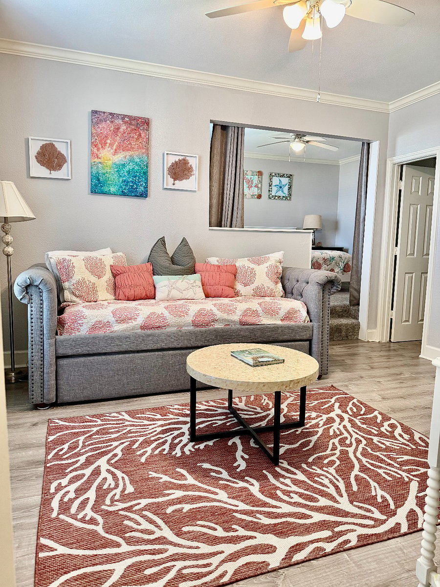 Master suite entry to trundle room looking into the king bedroom with window looking out to beach