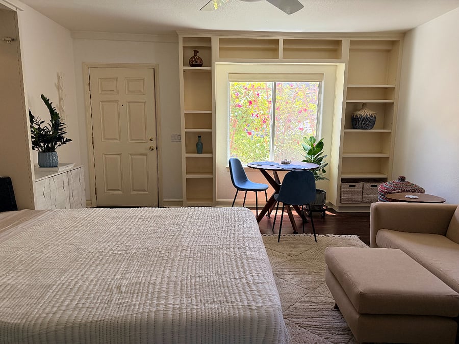Looking towards front door with bed folded down