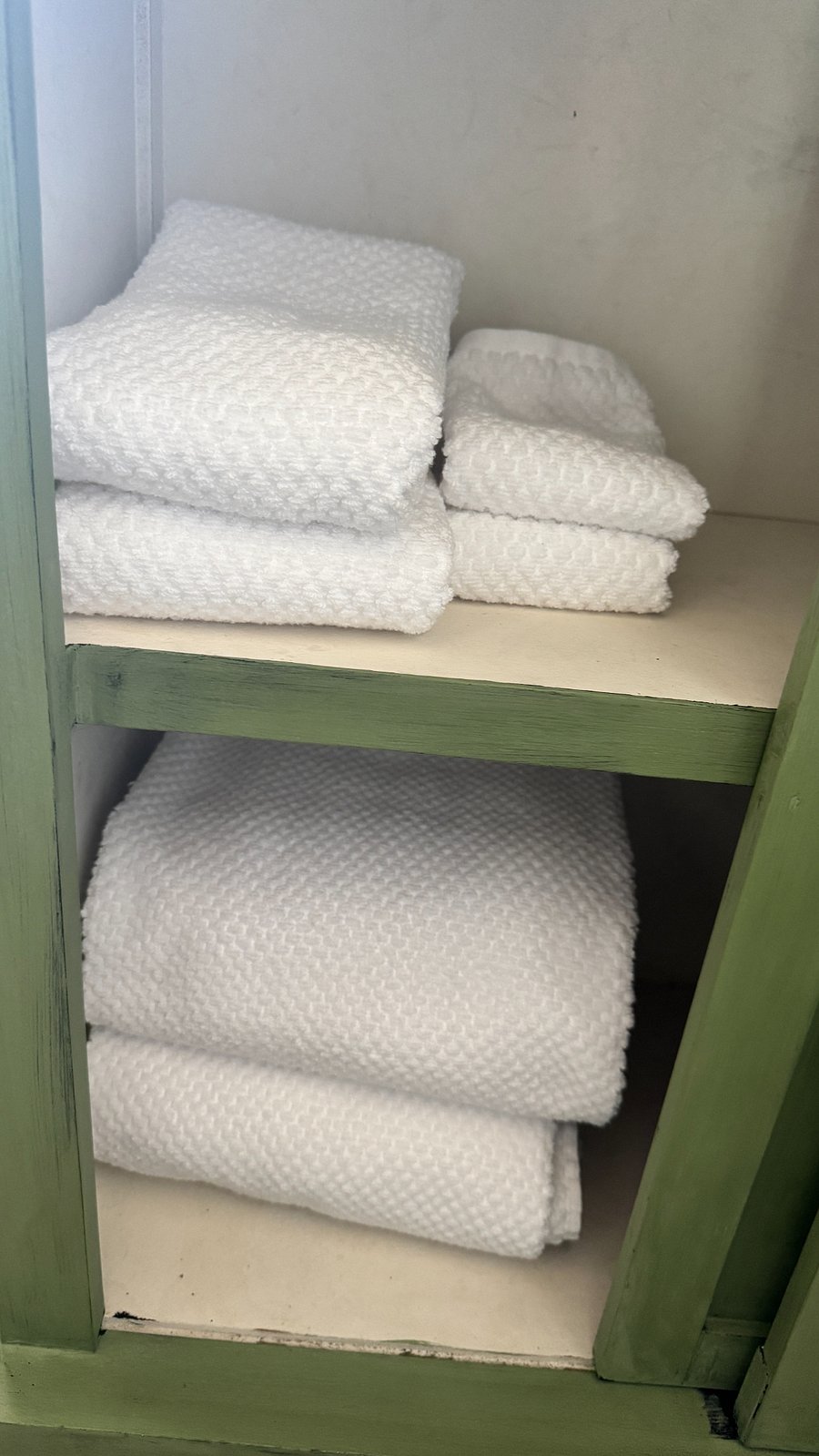 Fresh new linens and storage in Coffee Bar