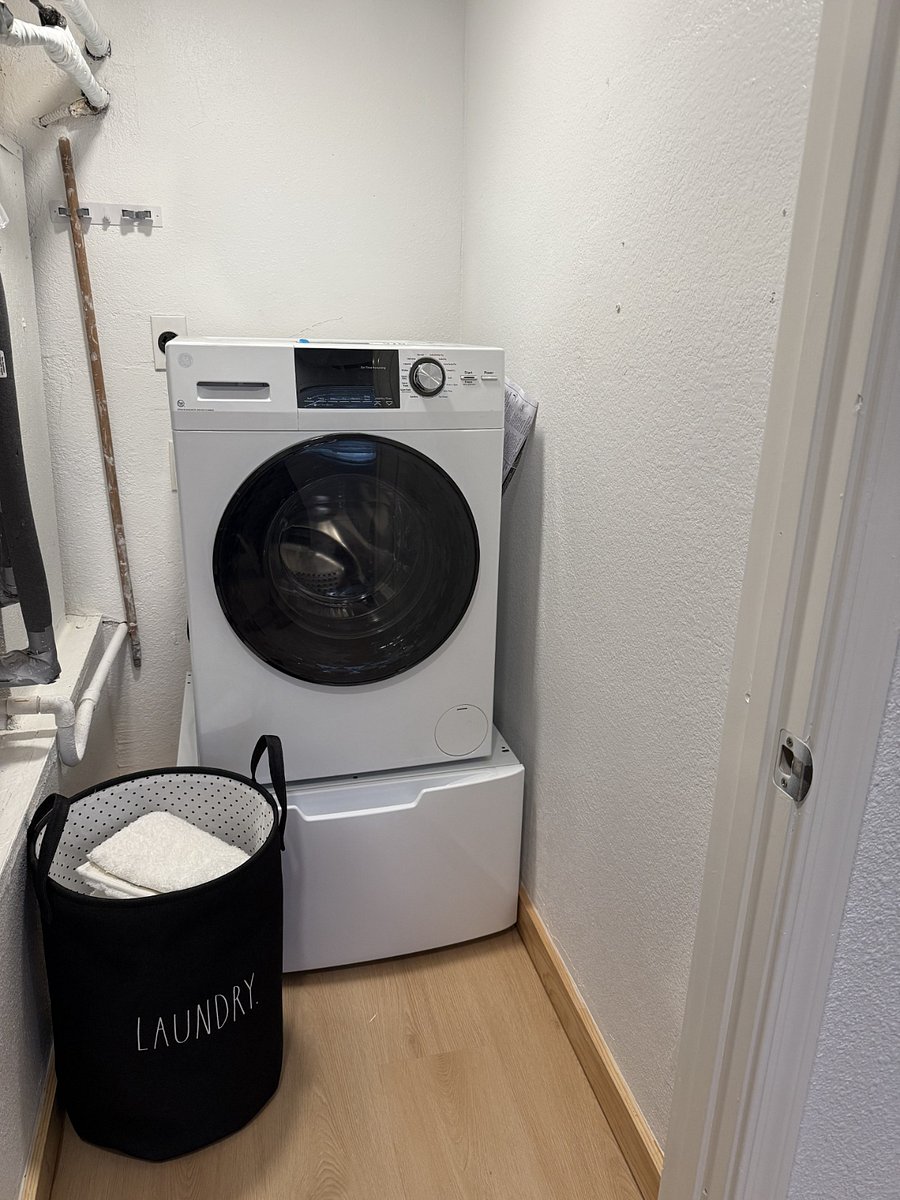 In-unit washer/dryer combo. Also has on-site laundry facility.