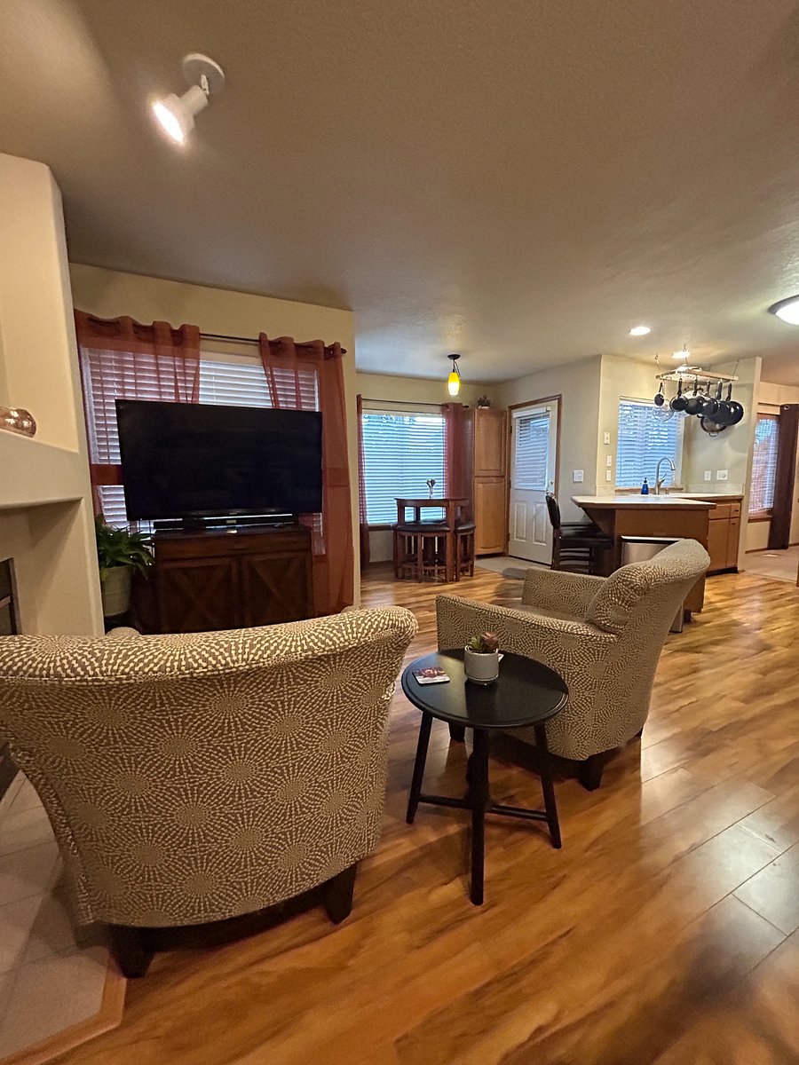 Additional Seating Area with TV and Breakfast Nook in the background
