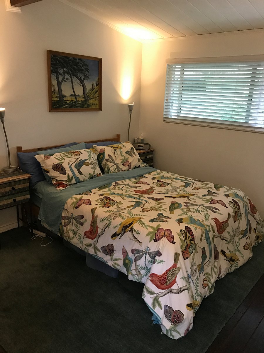 Queen bed and side tables, primary