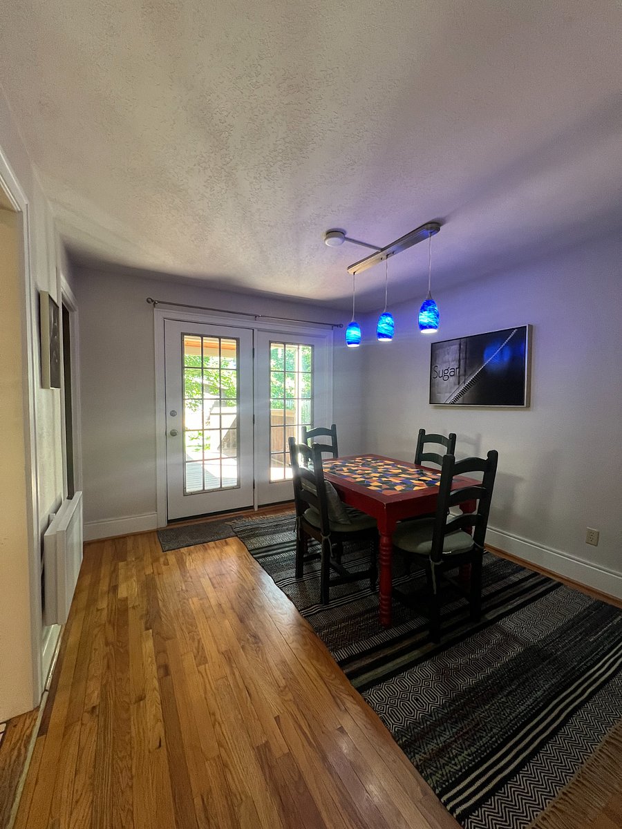 Dining Area with French Door leading out to covered deck in backyard