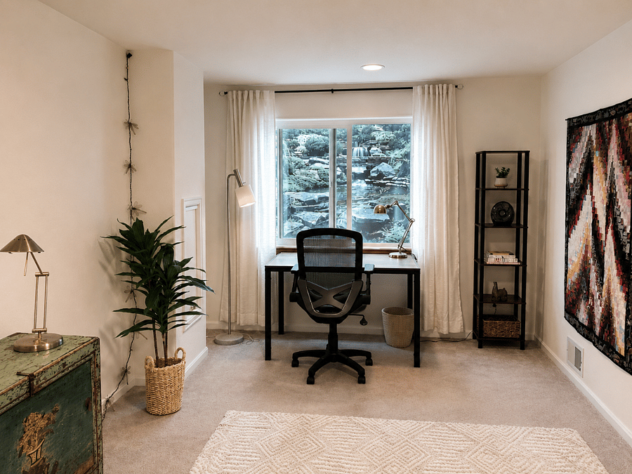 Private home office area by bright window