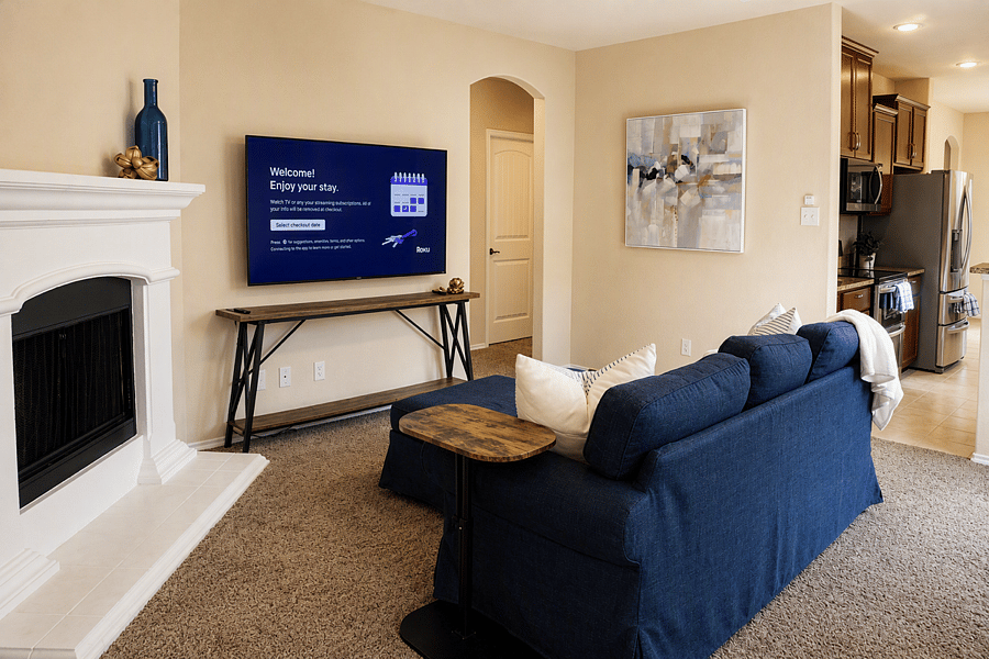 Comfortable living space with a 65" Smart Roku TV.