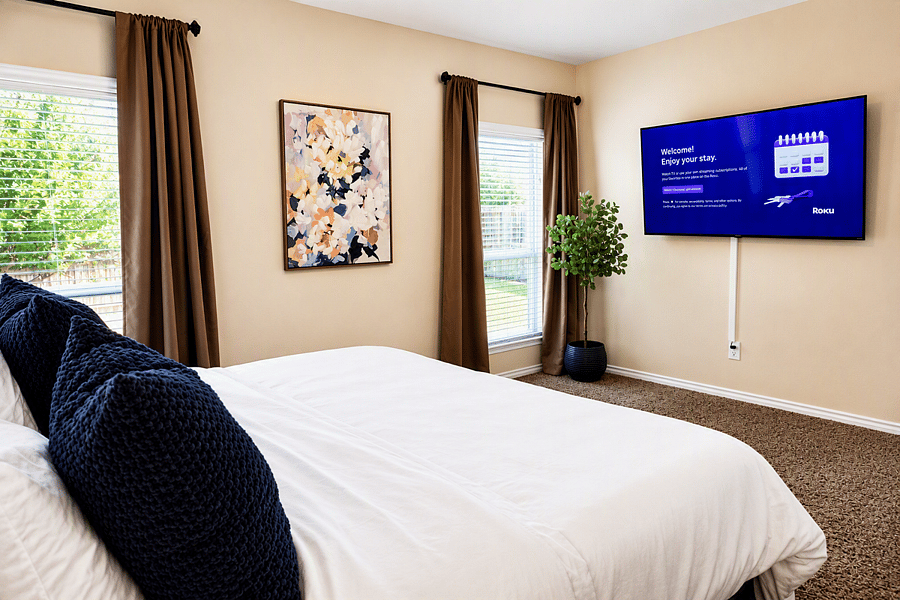 Luxury Master Suite.
Unwind in the beautifully appointed master bedroom featuring a comfortable king bed, hotel-quality linens, blackout drapes for restful sleep, and a 65" Smart Roku TV for relaxing evenings.  Designed for guest comfort and convenience. 