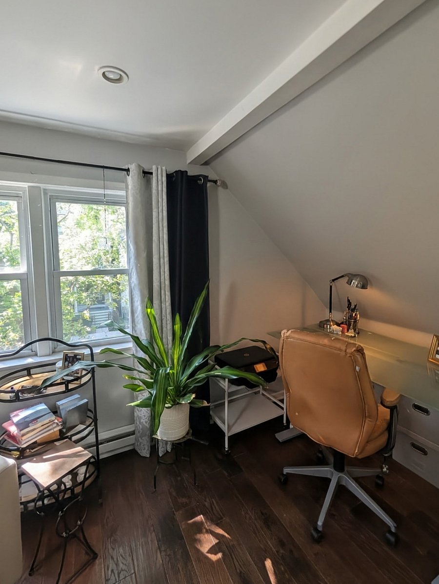 Upstairs is one large loft space with couch, desk & chair, coffee table and dresser.