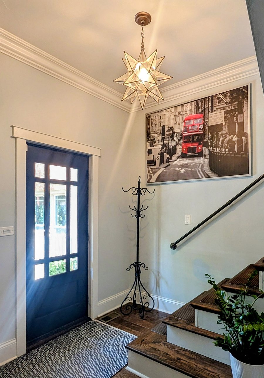 Access to second floor is near the front door.  Wood floors throughout the home, with stair runners.