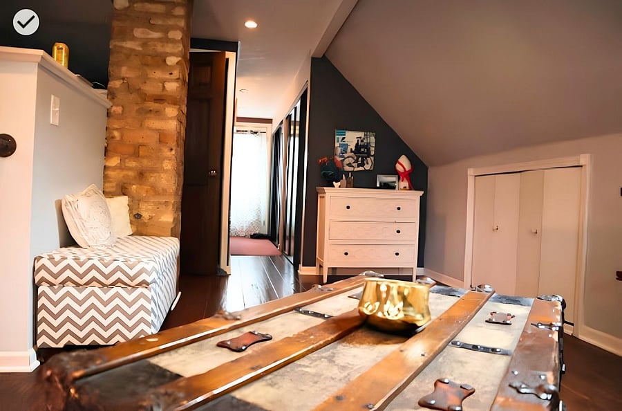 Upstairs is one large loft space with couch, desk & chair, coffee table and dresser.