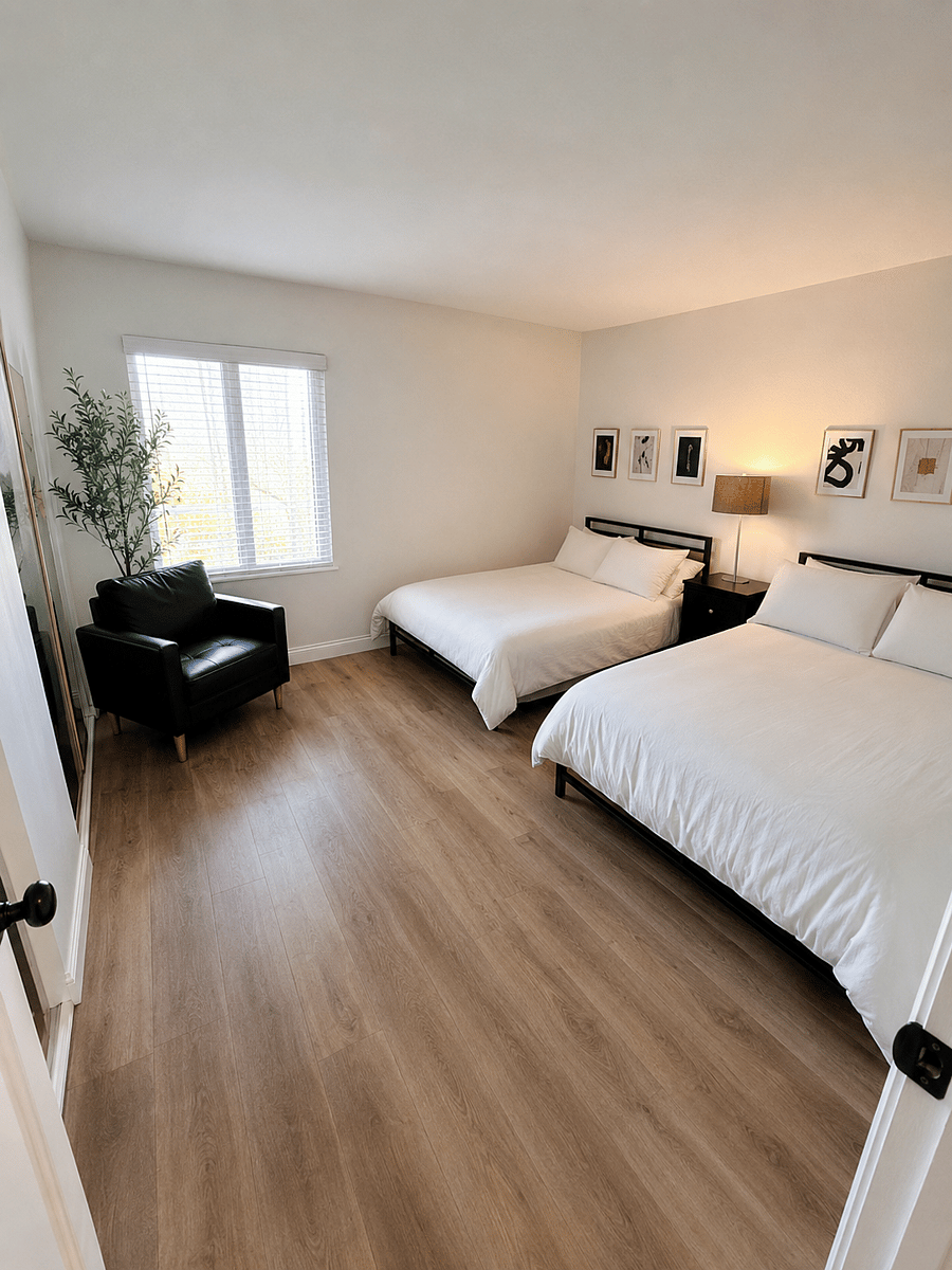 Spacious 2nd bedroom set up with 2 double beds and big TV.
