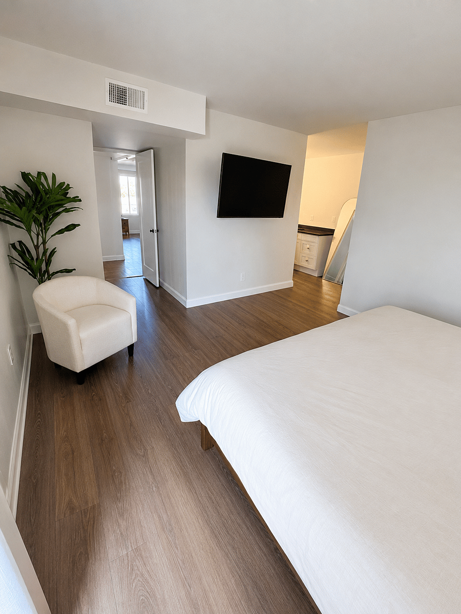 Spacious primary bedroom with comfy king bed-tv-private bathroom and walk in closet.