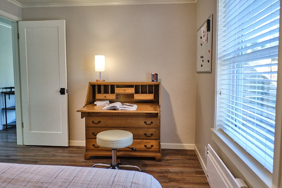 Bedroom with north-facing window, closet, and work desk