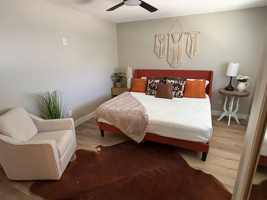Primary bedroom with king bed, smart tv and plenty of closet/storage space