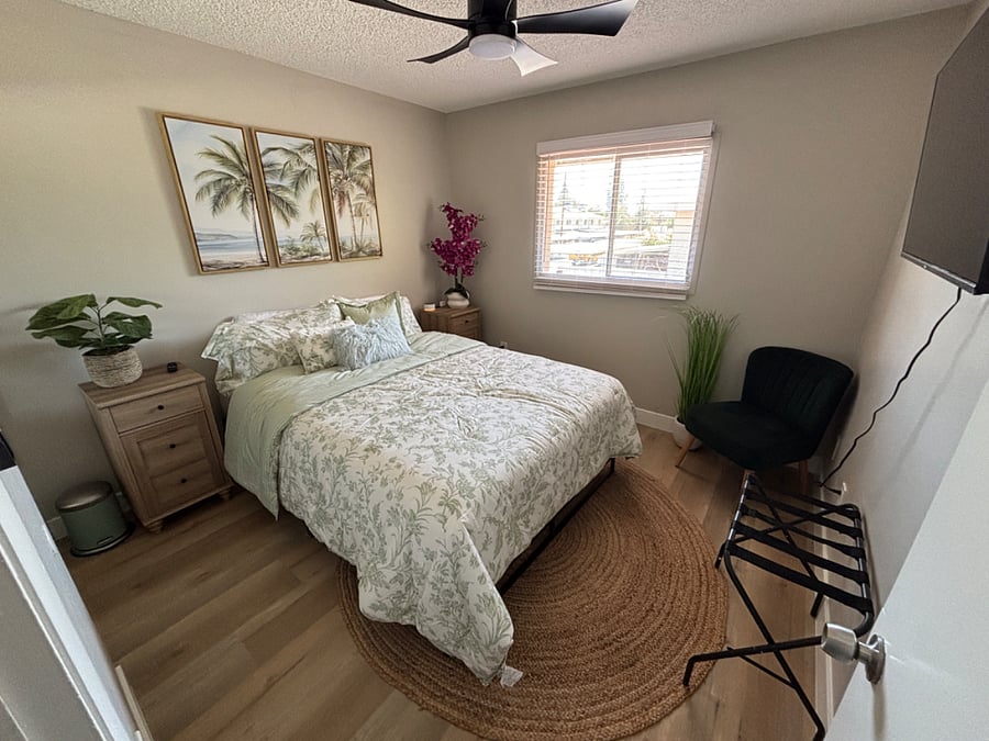 Bedroom 3, has queen bed, smart tv, and closet space