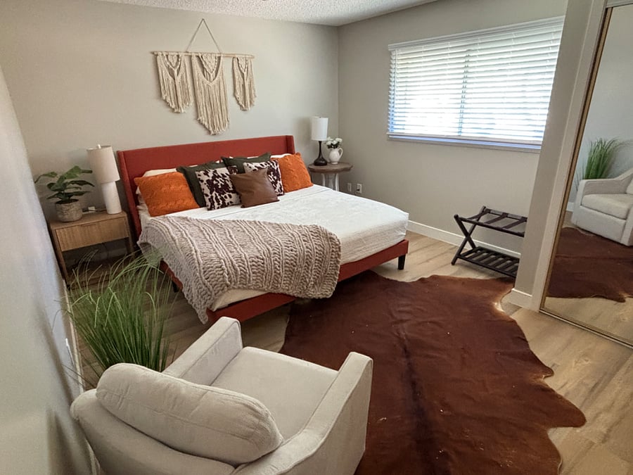Primary bedroom with king bed, smart tv and plenty of closet/storage space
