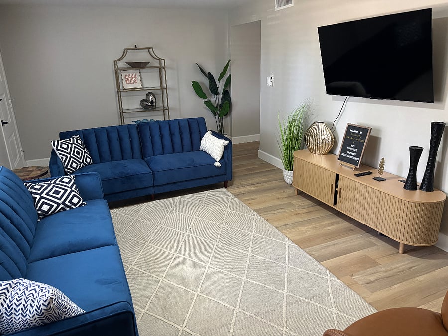 Large open family room with 55" smart tv.