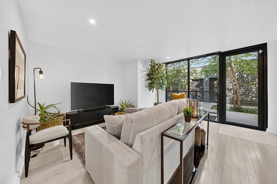 Level two living area with view entrance to one-car garage