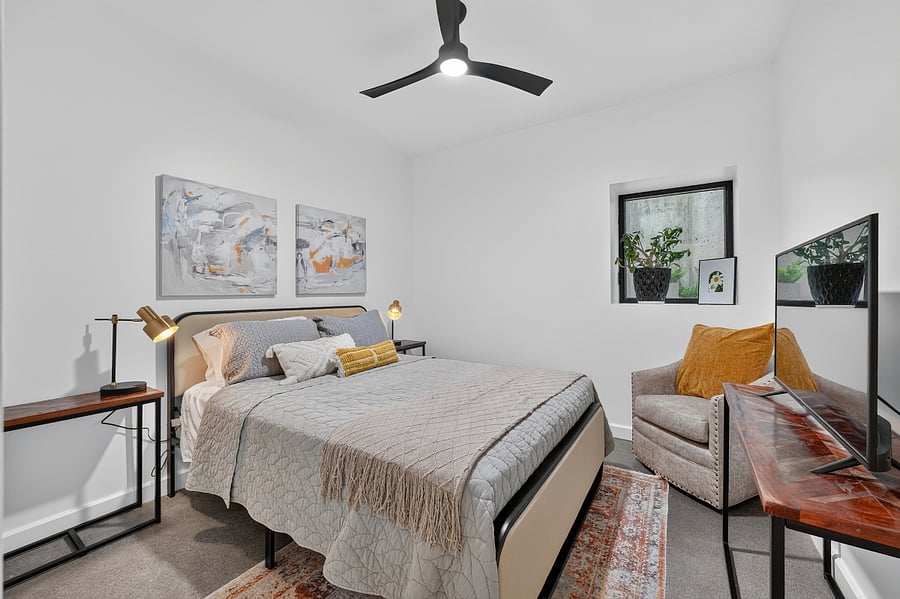 Bedroom 2 - Queen bed, smart TV view of cement garden