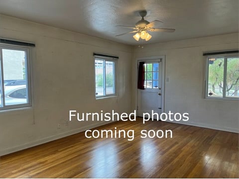 Bright Living Room with thermal windows, hardwood floors, and lovely views.
