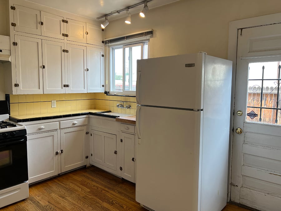 Charming kitchen with original cabinetry.