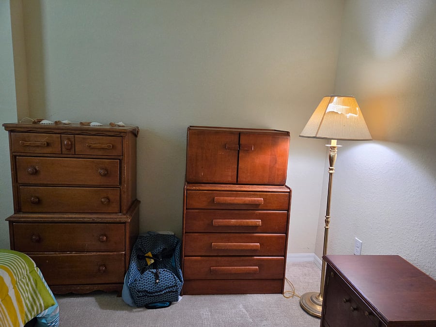 two dressers, another night stand and lamp.  Room also has ceiling fan with light.