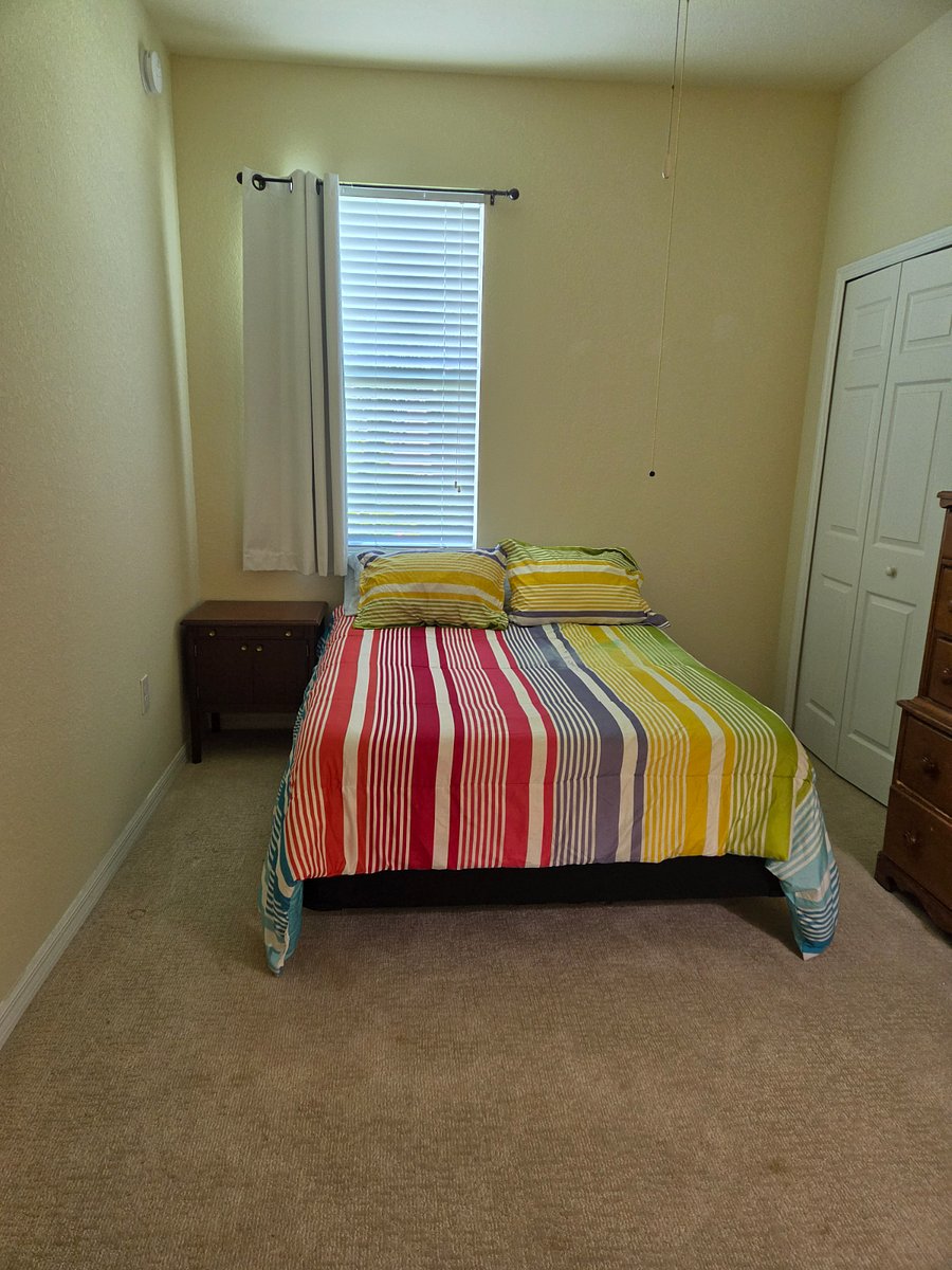 2nd guest room..Full Size Bed and one of two night stands, closet