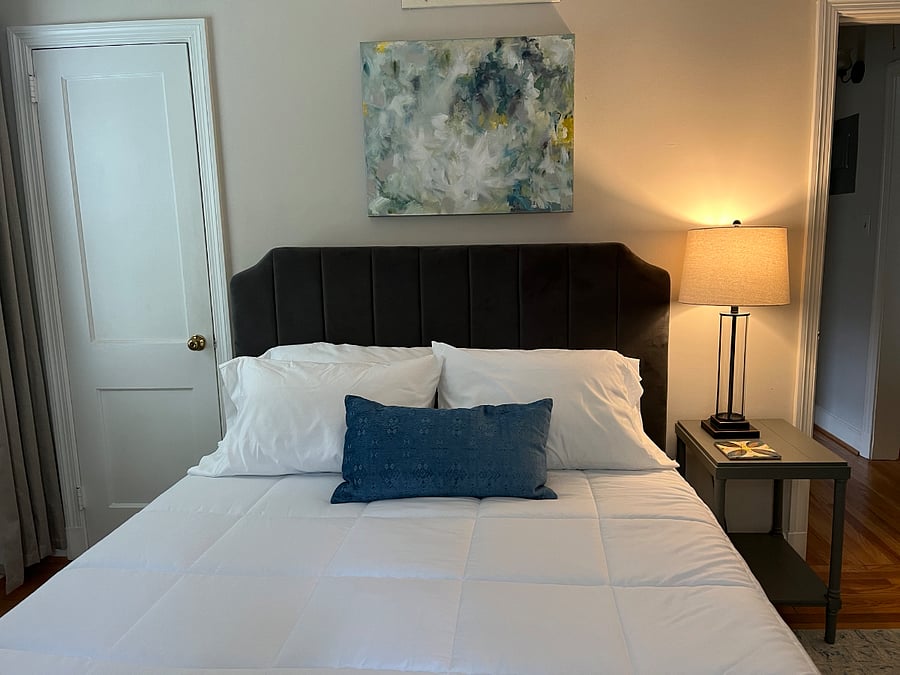 bedroom 1 with a queen bed, TV's in both bedrooms