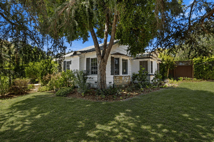 Large corner lot with HUGE fir tree offers lots of shade.