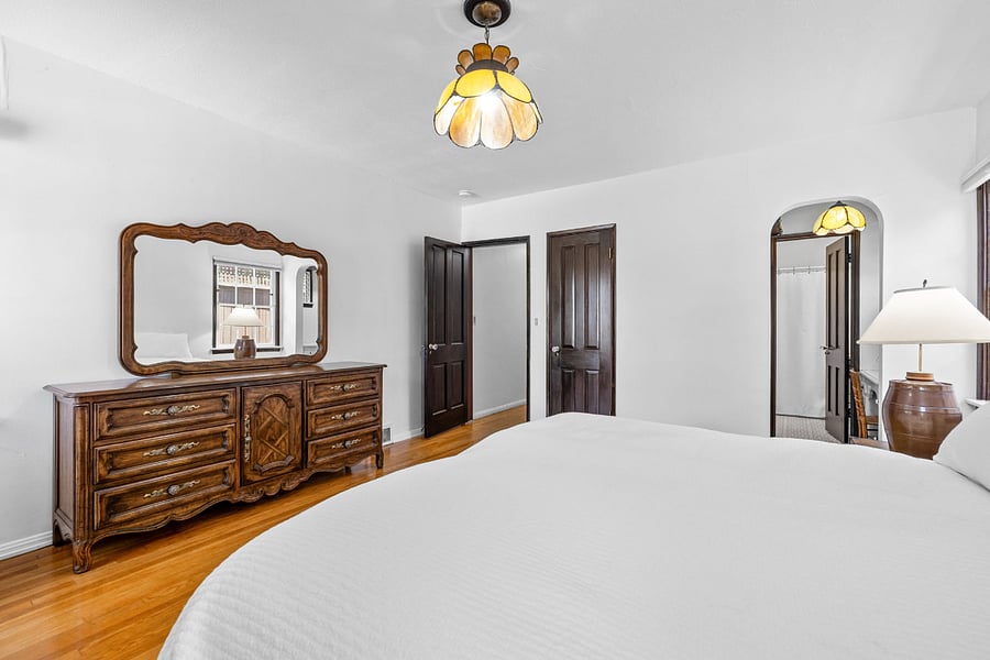 Primary bedroom with vanity area.