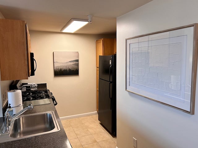 Fully stocked kitchen, gas range, microwave and dishwasher.