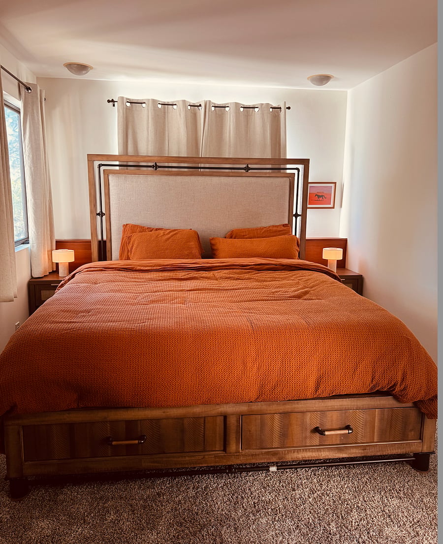 Your room! Two storage drawers underneath. Bedside tables have built in USB chargers.