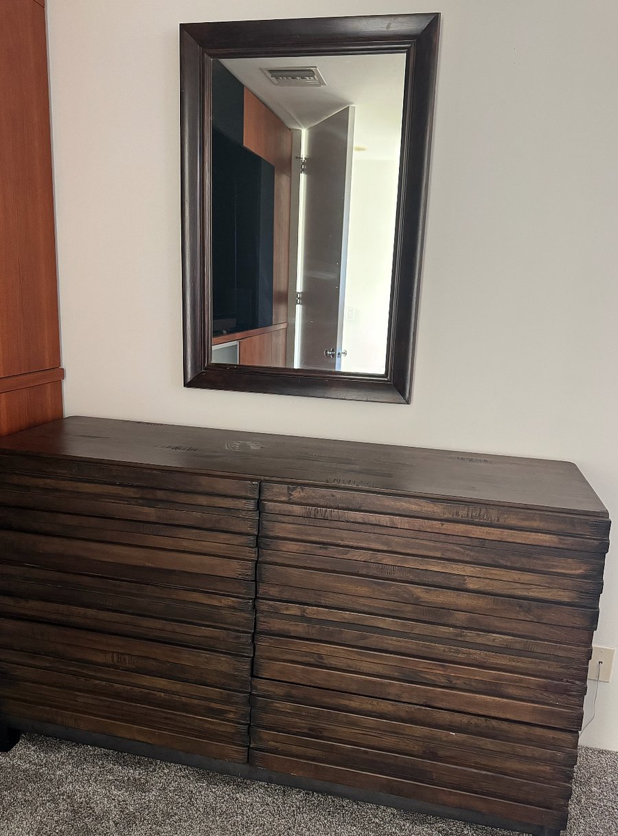 Large dresser for storage (no built in closet - smaller room has one for an extra fee).