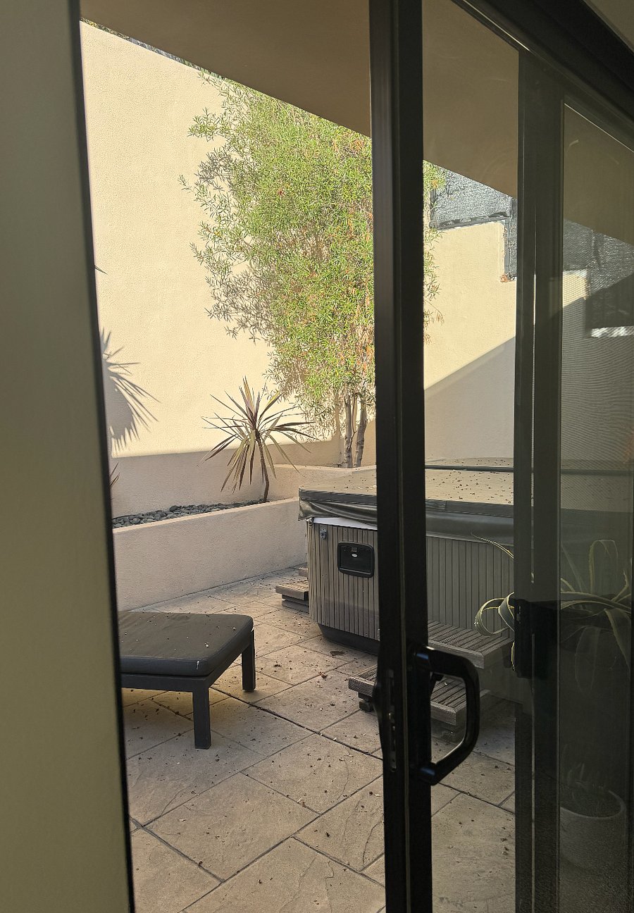 Private entrance around hot tub with private outdoor area on second floor.