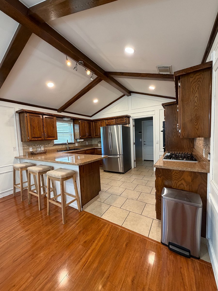 Kitchen includes air fryer, microwave, fridge, dishwasher, gas stove with starter kitchen utensils like silverware, cups, bowls, plates, etc.
