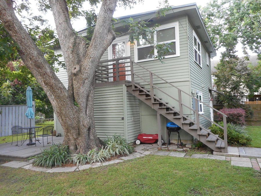 Tree shaded upstairs entrance with lots of windows!