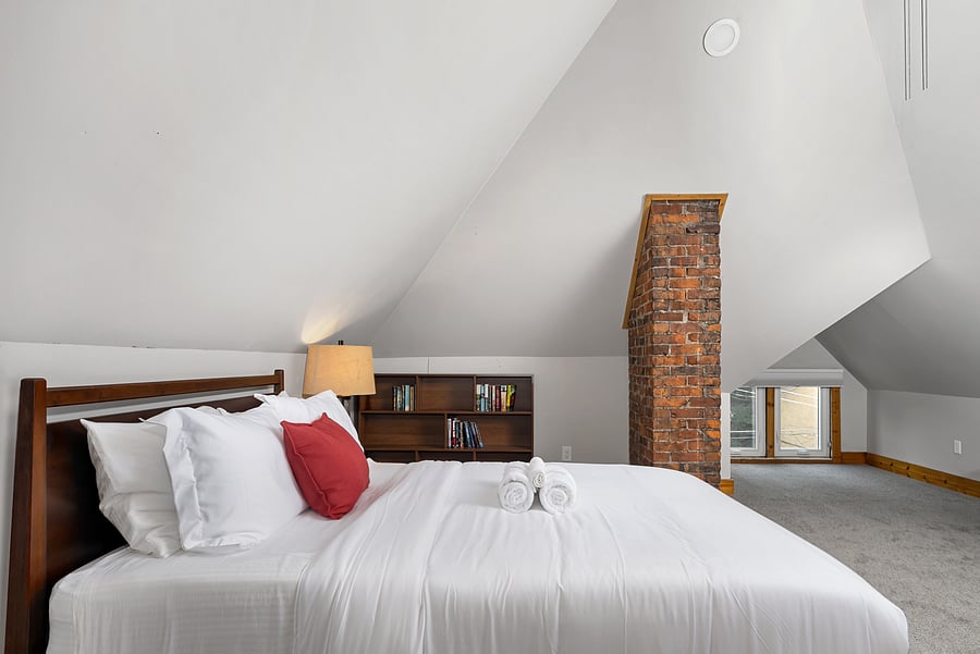 Third-floor lounge with exposed brick and comfortable floor seating